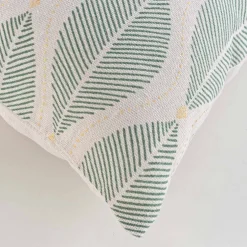 Coussin imprimé feuilles détails dorés