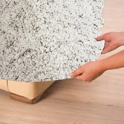 Housse bi-extensible microfibre effet faux uni pour fauteuil et canapé