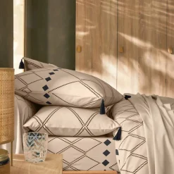 Linge de lit Massaï coton à motifs graphiques et finitions pompons