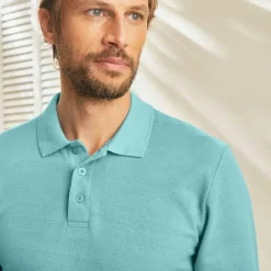 Polo uni maille piquée manches longues